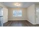 Simple dining area with gray vinyl flooring and a window at 329 Mount Zion Sw Rd, Atlanta, GA 30354