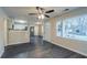Open living room with dark gray vinyl flooring and kitchen view at 329 Mount Zion Sw Rd, Atlanta, GA 30354