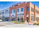 Brick buildings with retail stores and restaurants in a town square at 3345 Hillshire Dr, Cumming, GA 30028