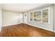 Bright living room featuring hardwood floors and large windows at 2106 Miriam Ln, Decatur, GA 30032