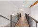 Bright hallway with hardwood floors and elegant railing at 3340 Hillshire Dr, Cumming, GA 30028