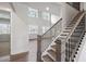 Modern staircase with dark wood and metal railing at 3340 Hillshire Dr, Cumming, GA 30028