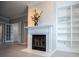 White fireplace mantel with built-in shelving at 7169 Woodridge Ln, Union City, GA 30291