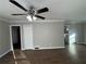 Living room with hardwood floors, ceiling fan, and neutral walls at 721 Yale Sw Pl, Atlanta, GA 30315