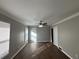 Spacious living room featuring hardwood floors and ceiling fan at 721 Yale Sw Pl, Atlanta, GA 30315