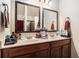 Double vanity bathroom with large mirrors and a shower at 121 Shimmering Waters Ln, Fayetteville, GA 30214