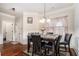 Dining room with hardwood floors and a granite table at 121 Shimmering Waters Ln, Fayetteville, GA 30214