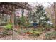 Landscaped backyard with stone pathway and bird feeders, creating a tranquil atmosphere at 2688 Crystal Ln, Lawrenceville, GA 30044
