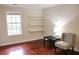 Spacious bedroom with hardwood floors and built-in shelving at 2688 Crystal Ln, Lawrenceville, GA 30044