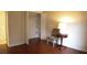 Bedroom with hardwood floors, closet and a side table at 2688 Crystal Ln, Lawrenceville, GA 30044