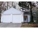 Three-car garage, white exterior, landscaping at 2688 Crystal Ln, Lawrenceville, GA 30044
