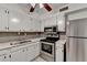 Bright kitchen, featuring stainless steel appliances and white cabinets at 123 Maison Nw, Atlanta, GA 30327