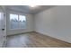 Spacious bedroom with hardwood floors and large window at 1258 Prospect Rd, Lawrenceville, GA 30043