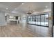 Open concept Gathering room with hardwood floors, fireplace and pool view at 1258 Prospect Rd, Lawrenceville, GA 30043