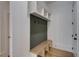 Functional mudroom with built-in bench and hooks at 1258 Prospect Rd, Lawrenceville, GA 30043