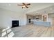 Open concept kitchen with island, stainless steel appliances, and light gray cabinets at 138 Frontier Way, Mcdonough, GA 30253