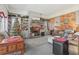 Cozy living room with a fireplace, built-in shelving, and a Christmas tree at 2051 Sheffield Rd, Conyers, GA 30012