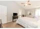 Main bedroom with ensuite bath, walk-in closet, and ceiling fan at 775 Freeman Dr, Covington, GA 30016