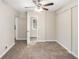 Well-lit bedroom with plush carpeting and ceiling fan at 1620 Flintwood Se Dr, Atlanta, GA 30316