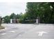 Gated community entrance with automated security gates at 1180 Hartwell Rd, Locust Grove, GA 30248