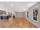 Hardwood floors and an open floor plan in this bright and spacious living room at 1658 Brockett Rd, Tucker, GA 30084