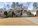 Two-story house with stone accents and manicured lawn at 195 Brookhollow Trce, Johns Creek, GA 30022