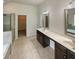 Double vanity bathroom with a walk-in shower and soaking tub at 607 Stream Ct, Fairburn, GA 30213