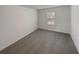 Bright bedroom featuring grey carpet and a window at 607 Stream Ct, Fairburn, GA 30213