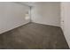 Empty carpeted bedroom with a window and closet at 607 Stream Ct, Fairburn, GA 30213