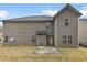 Two story house with grey siding and small backyard at 607 Stream Ct, Fairburn, GA 30213