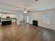 Open living room with kitchen and fireplace views at 607 Stream Ct, Fairburn, GA 30213