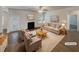 Virtually staged living room with a fireplace and hardwood floors at 607 Stream Ct, Fairburn, GA 30213