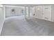 Finished basement featuring neutral carpeting and multiple windows at 6841 Cherry Log Pl, Austell, GA 30168