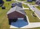 Aerial view of home, showcasing backyard and driveway at 1468 Harlequin Way, Stockbridge, GA 30281