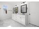 Double vanity bathroom with marble flooring and a walk-in shower at 2587 Kingsley Ne Dr, Marietta, GA 30062