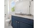 Bathroom with blue vanity, granite countertop and shower/tub at 2587 Kingsley Ne Dr, Marietta, GA 30062