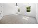 Well-lit bedroom with grey carpet and two windows at 2587 Kingsley Ne Dr, Marietta, GA 30062