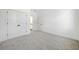 Spacious bedroom with grey carpet and a view of the bathroom at 2587 Kingsley Ne Dr, Marietta, GA 30062