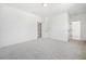 Bright bedroom with grey carpet and access to another room at 2587 Kingsley Ne Dr, Marietta, GA 30062