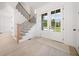 Light-filled entryway with hardwood floors and a view of the staircase and front door at 2587 Kingsley Ne Dr, Marietta, GA 30062