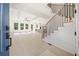 Bright entryway with hardwood floors, staircase, and views into the living room at 2587 Kingsley Ne Dr, Marietta, GA 30062