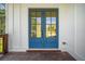 Blue double front doors with glass panes leading to a wooden deck at 2587 Kingsley Ne Dr, Marietta, GA 30062