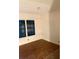 Empty bedroom with wood-look floors and window at 815 Dogwood Trl, Jonesboro, GA 30238
