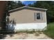 Tan mobile home with white skirting at 815 Dogwood Trl, Jonesboro, GA 30238