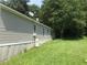 Tan mobile home with grassy backyard at 815 Dogwood Trl, Jonesboro, GA 30238