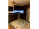 Spacious kitchen with dark wood cabinets and modern appliances at 815 Dogwood Trl, Jonesboro, GA 30238