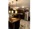 Kitchen with an island, dark wood cabinets, and stainless steel appliances at 815 Dogwood Trl, Jonesboro, GA 30238
