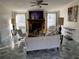 Living room with a fireplace, white couch, and rocking chairs at 815 Dogwood Trl, Jonesboro, GA 30238