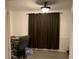 Bright office features wood-look floors and brown curtains at 815 Dogwood Trl, Jonesboro, GA 30238
