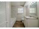 Updated bathroom with granite vanity and marble tile at 1471 Midview Dr, Decatur, GA 30032
